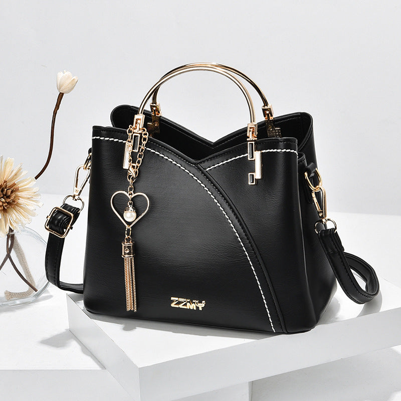 Bolso de mano lujoso con acabado elegante y correa ajustable – LOREVIA